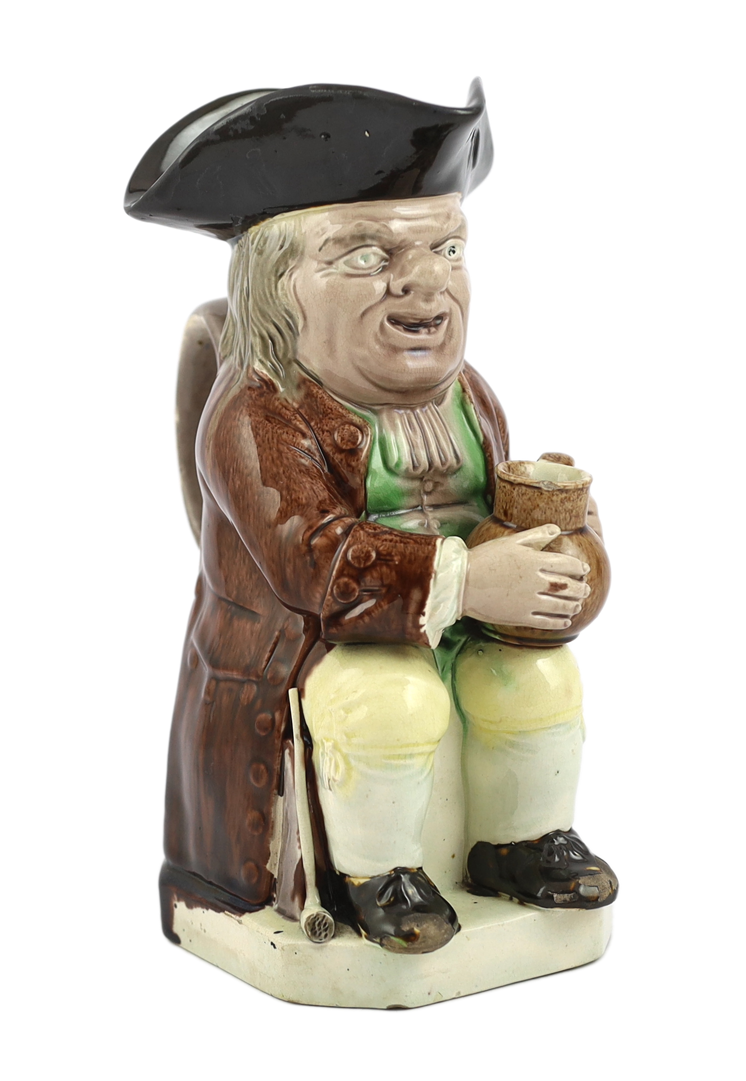 A Ralph Wood type creamware Toby jug of standard type, c.1790, glaze losses and some retouching to the enamels